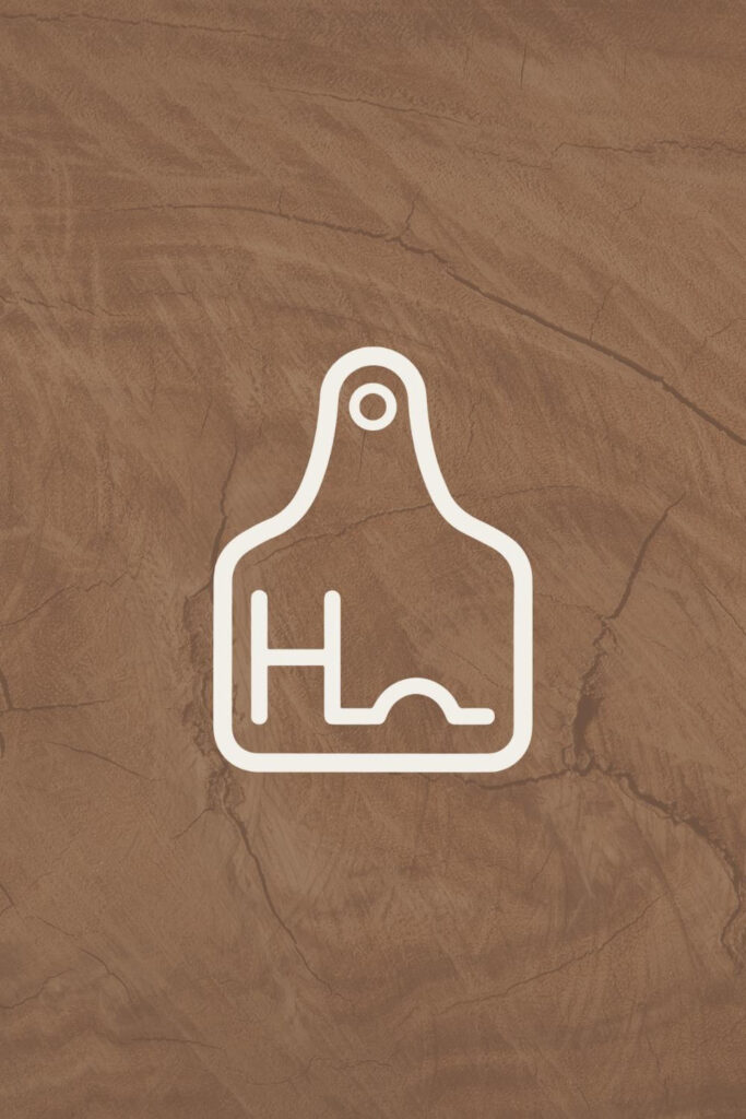 harding ranch ear tag brand mark on wood background