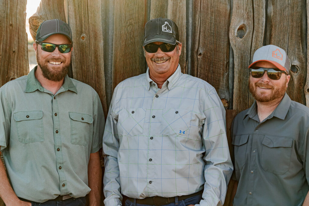 father and two sons of harding family cattle ranch