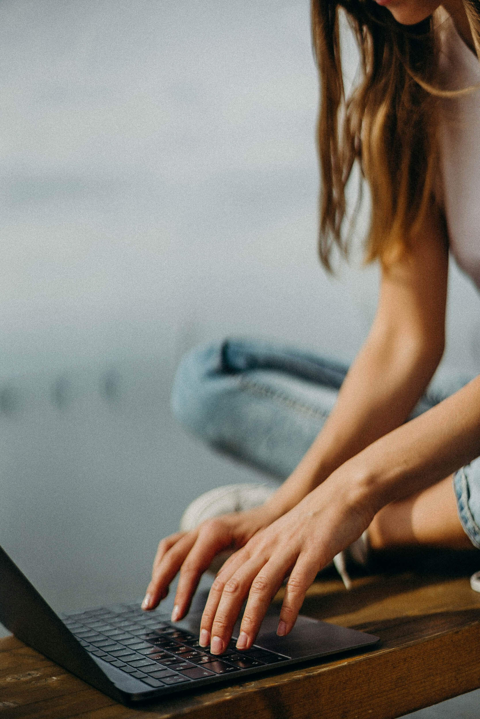 woman on a macbook computer